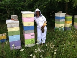 My super awesome beekeeping assistant posing with some of our super crazy bees!